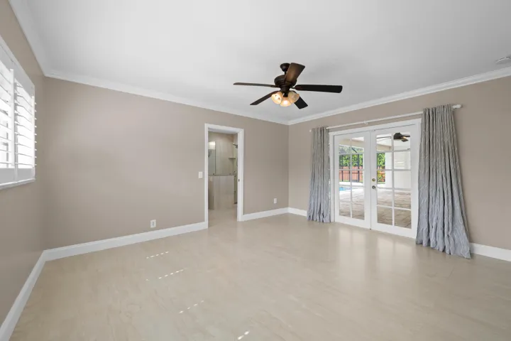 Bedroom has view of the pool.