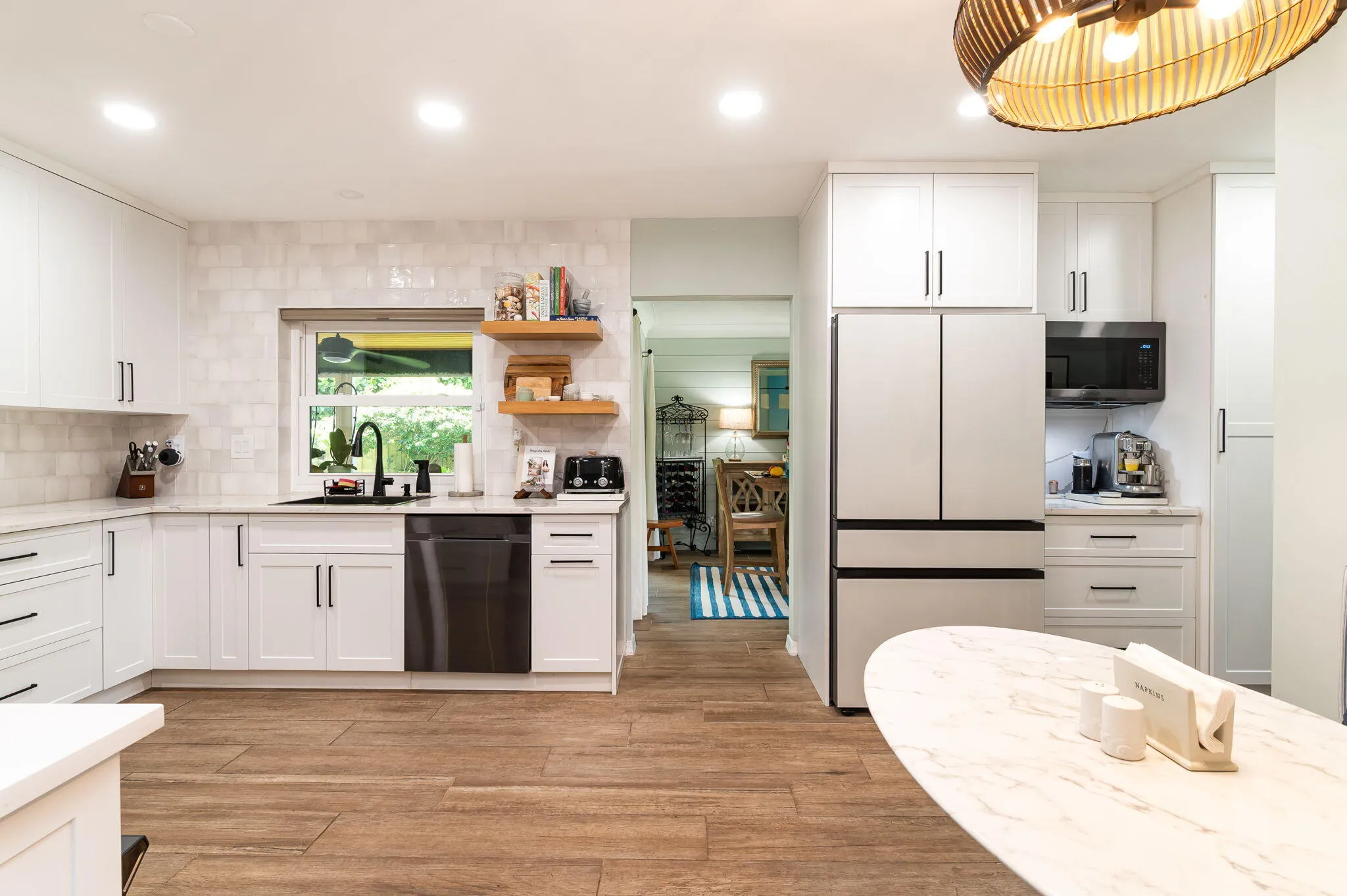 Large eat in kitchen with custom cabinetry and custom built ins