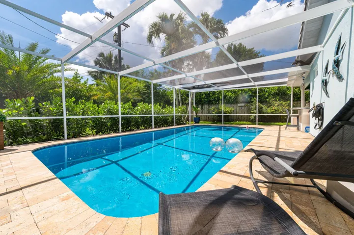 Another view of the pool with beautiful paved perimeter