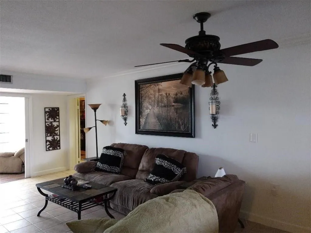 Living area featuring tiled flooring and neutral wall tones