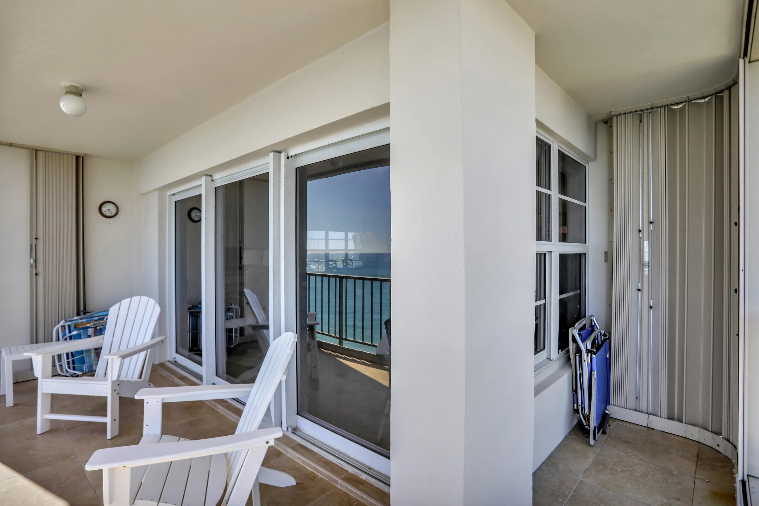 Wrap around NE corner with hurricane shutters to protect patio furniture.