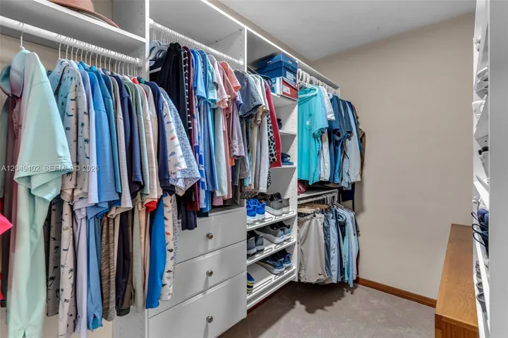 WALKIN CLOSET WITH CUSTOM SHELVING