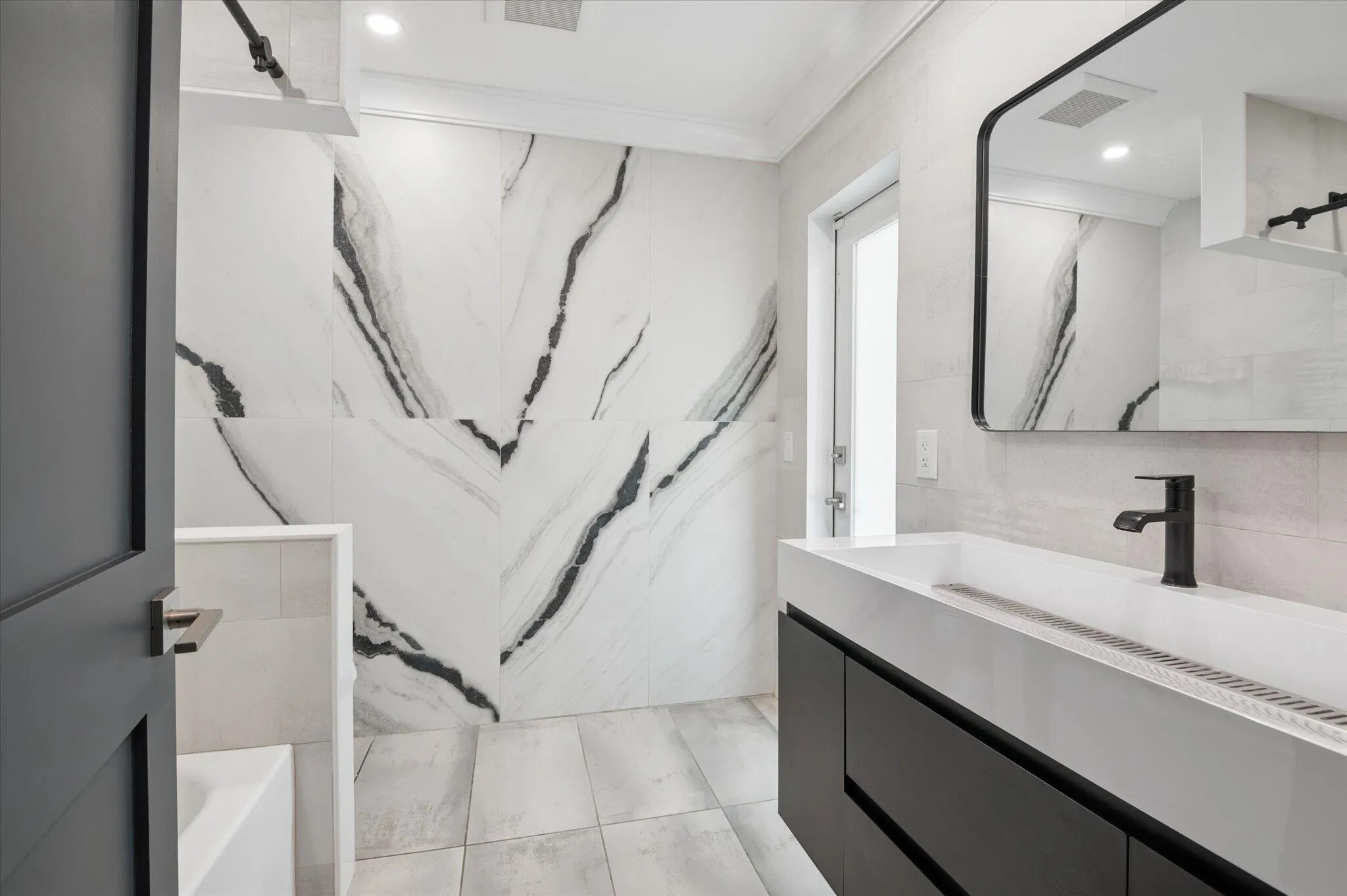 GUEST BATHROOM LEADING OUT TO POOL
