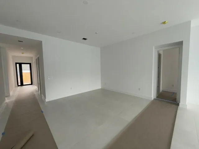 Formal dining room open to the living room and kitchen.