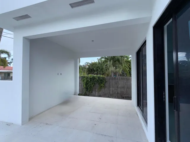Covered outdoor patio area complete with TV hookup.