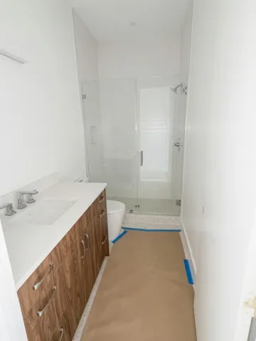 Guest Bath with terrazzo tile flooring.