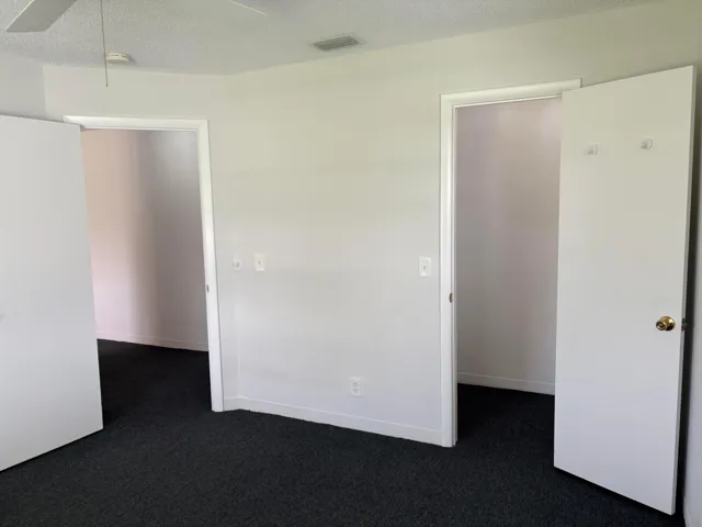 WALK IN CLOSET, DOOR TO HALLWAY AND ANOTHER DOOR TO BATHROOM