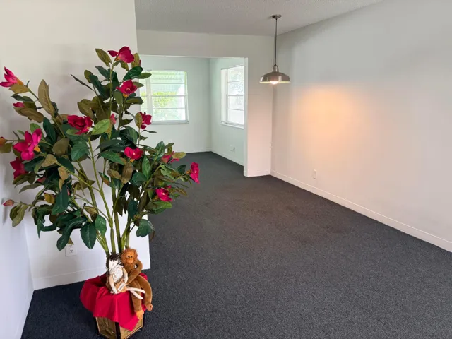 LIVING ROOM WITH DINING AREA & FAMILY ROOM BEYOND