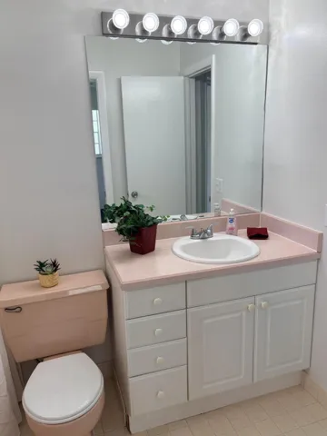 THIS IS A GUEST BATHROOM AS WELL AS AN EXTRA DOOR FROM GUEST BEDROOM