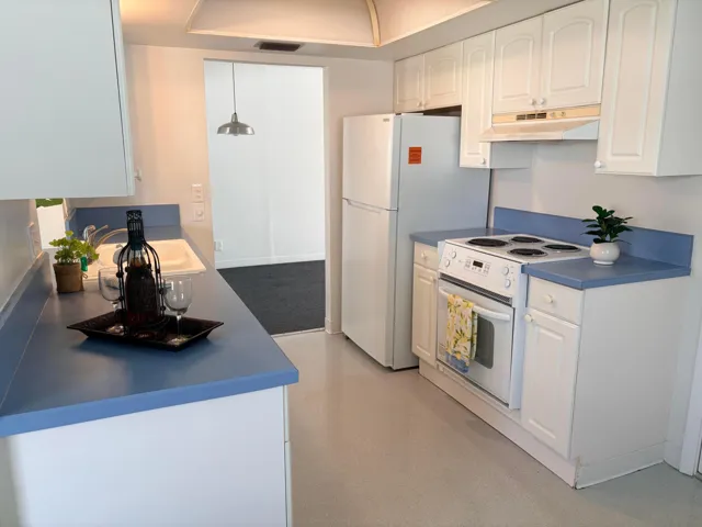 ANOTHER VIEW OF KITCHEN, ALL DECOR' IN THE HOME IS THE REALTORS