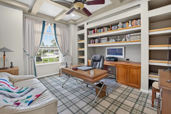 has coffered ceilings and built in book cases. Could easily be made into a 4th bedroom