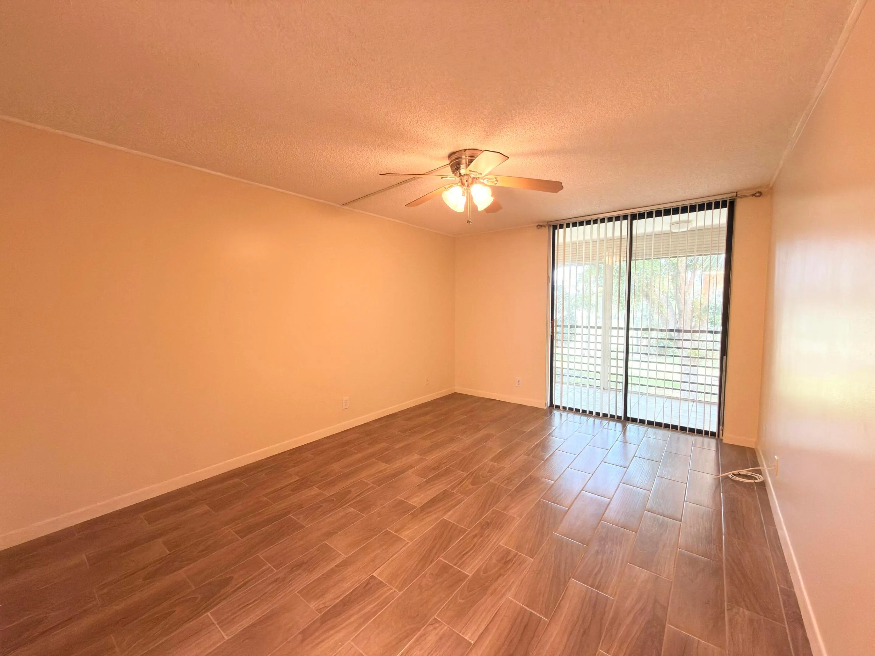 Very spacious primary bedroom with balcony access overlooking golf and lake views.