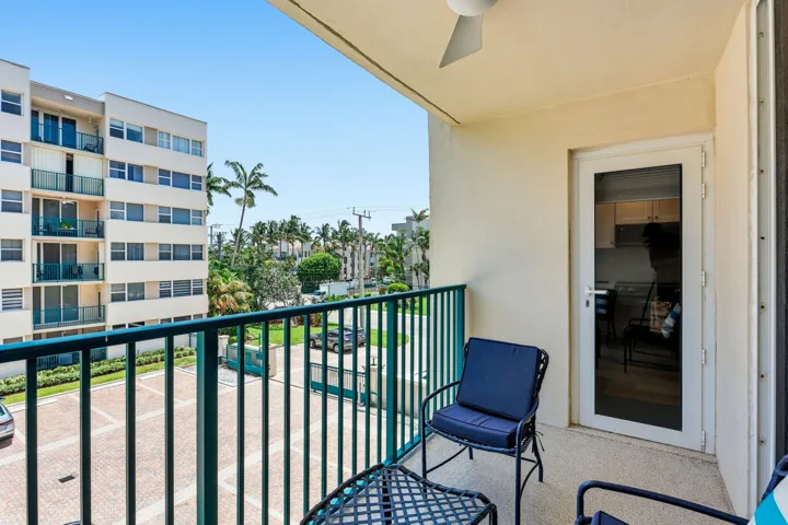 Private balcony featuring a ceiling fan, concrete flooring, and a sliding glass door entry point