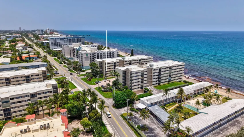 Coastal multi-story residential buildings featuring balconies and expansive ocean frontage