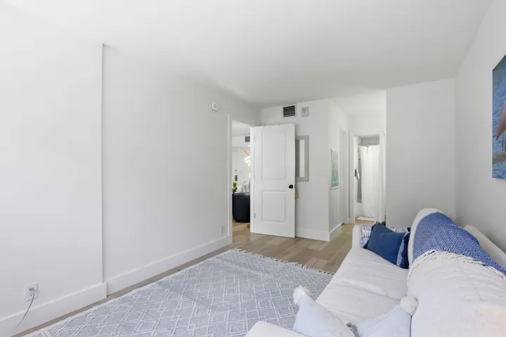 Neutral white walls complement light wood look finish flooring