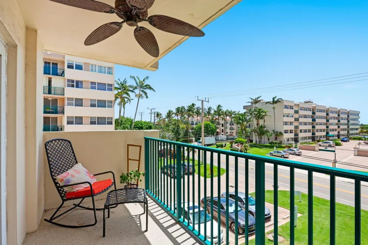 Private balcony with ceiling fan, providing outdoor space