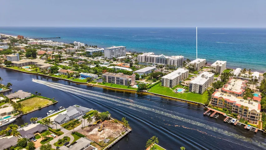 Coastal community featuring waterway access, residential buildings, and proximity to the ocean