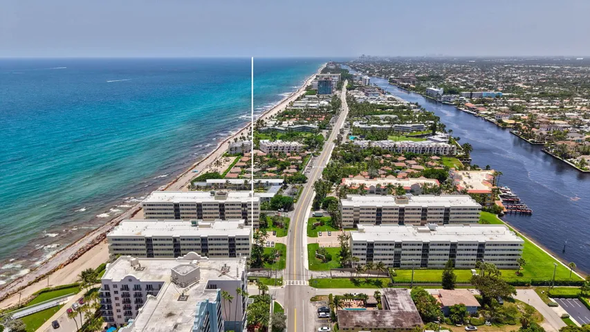 Aerial perspective highlighting beachfront properties, a coastal road, and an Intracoastal Waterway