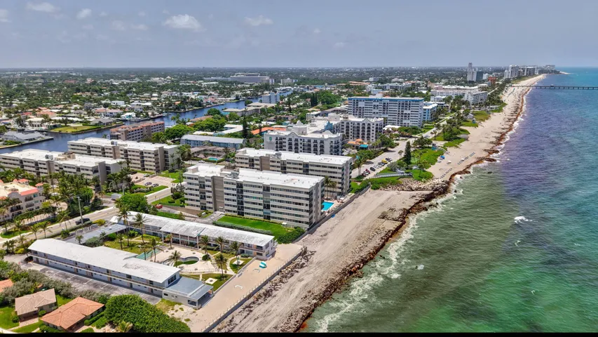 Coastal development featuring beachfront access and multiple multi-story residential buildings