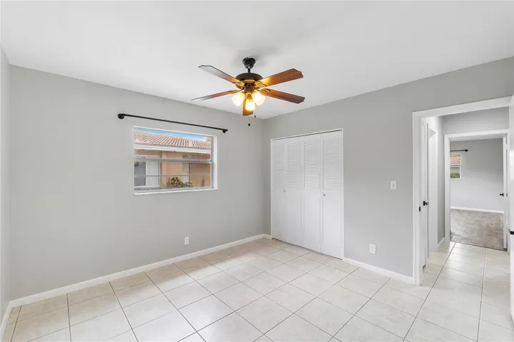 Light-toned tile flooring throughout the room