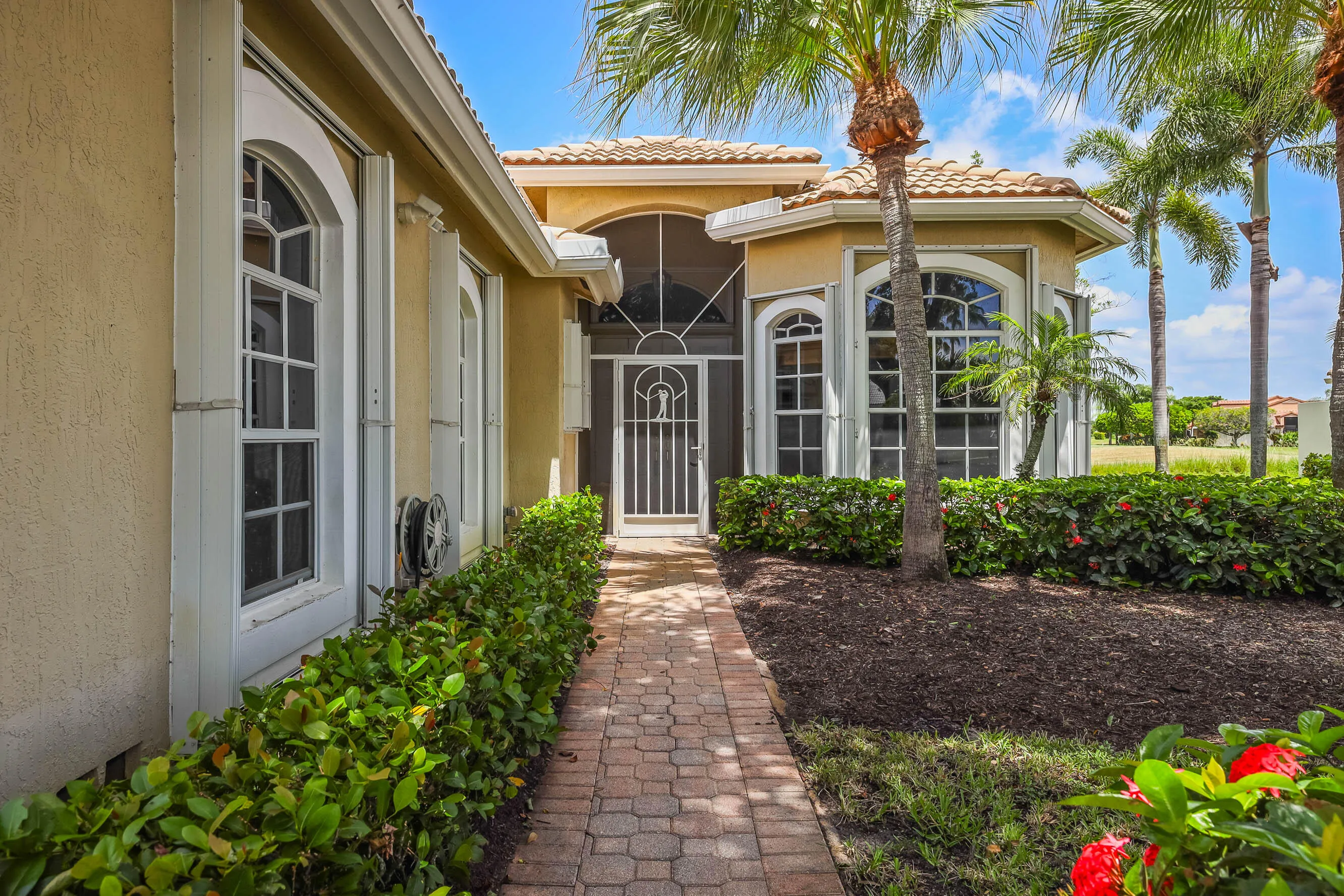 Stucco exterior with a tile roof