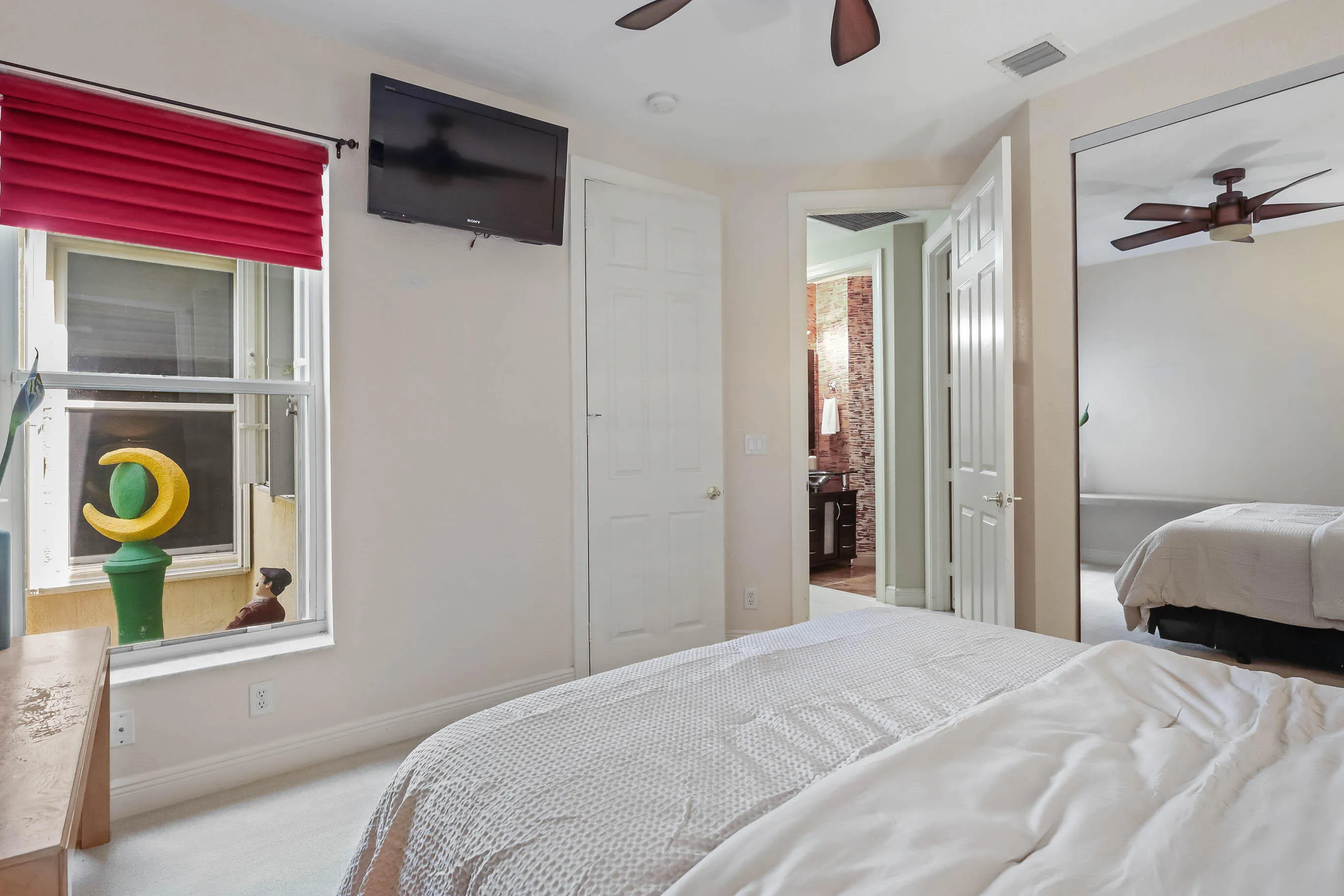 Interior room featuring neutral wall paint and light-colored carpeting