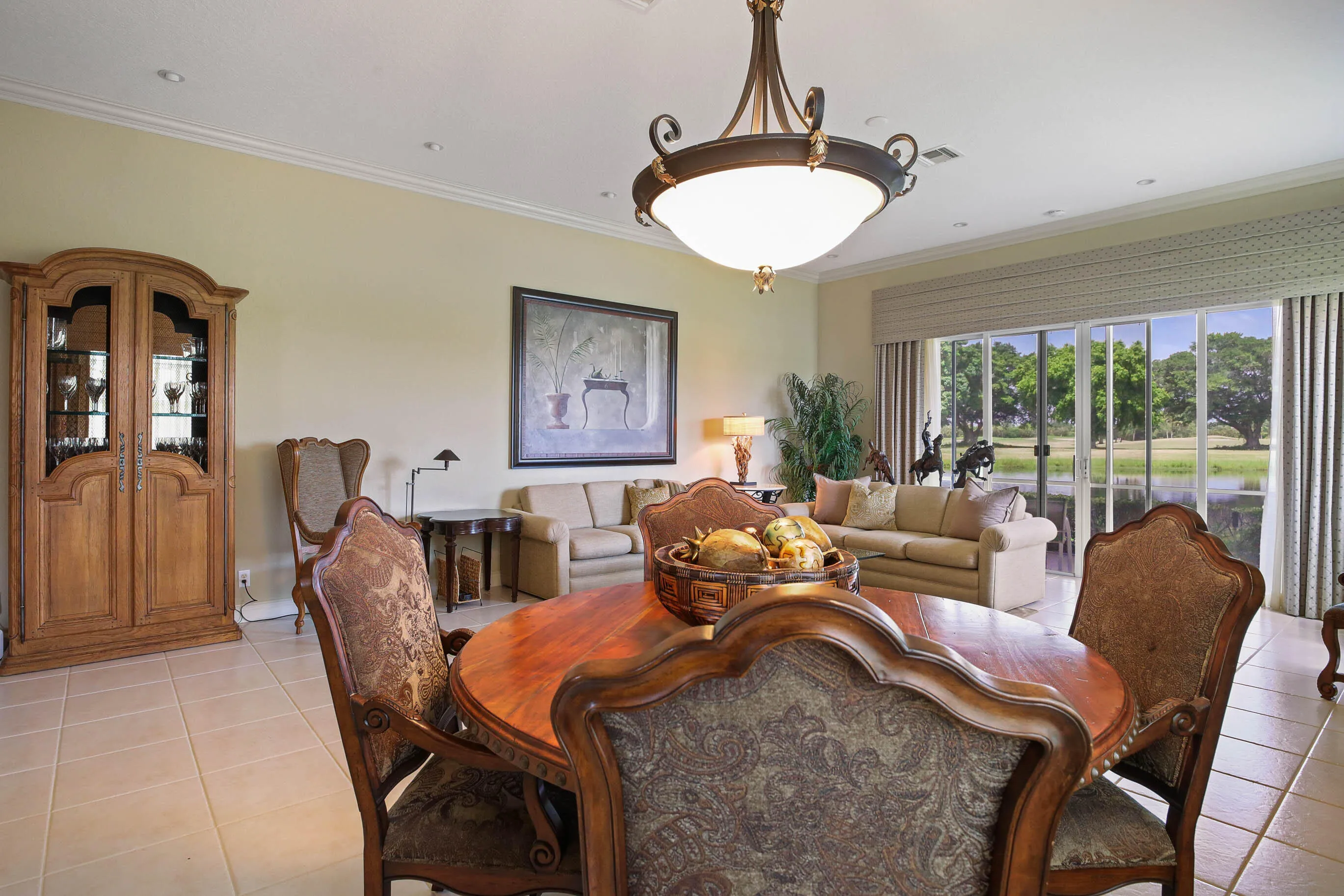 Open-concept interior featuring light-toned tile flooring throughout