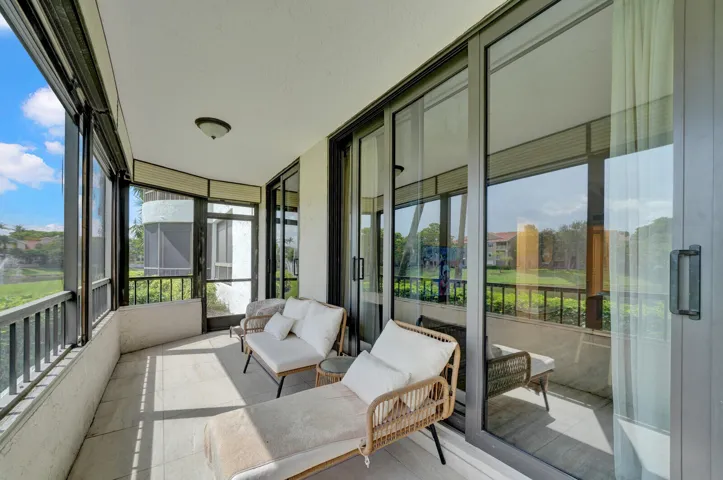 COVERED AND SCREENED PATIO WITH BEAUTIFUL LAKE VIEWS