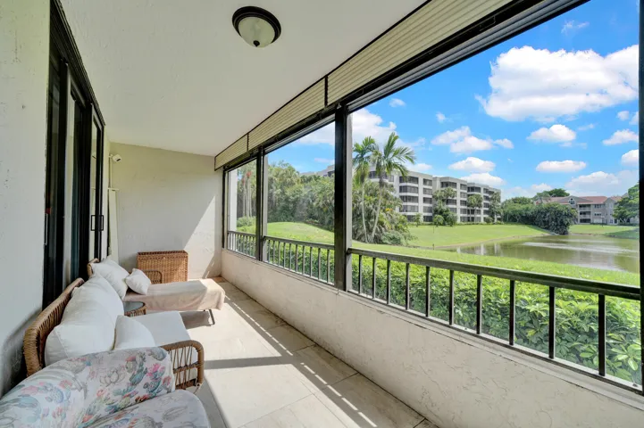 COVERED AND SCREENED PATIO WITH BEAUTIFUL LAKE VIEWS