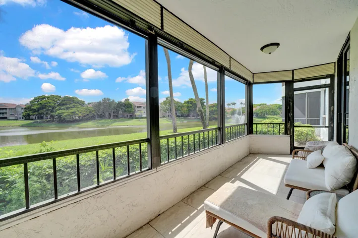 COVERED AND SCREENED PATIO WITH BEAUTIFUL LAKE VIEWS