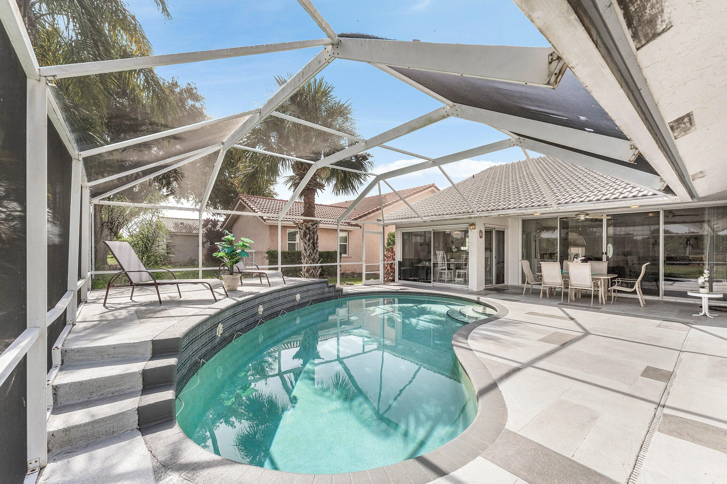 step up to enjoy the sunshine and tranquil pool!
