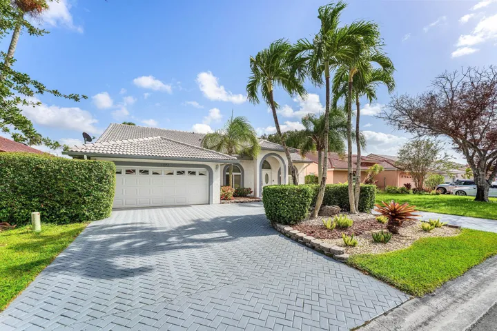 Lushly landscaped top notch curb appeal