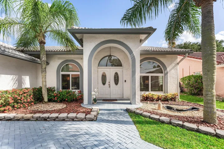 Double door entryway and circular Driveway welcome you HOME!