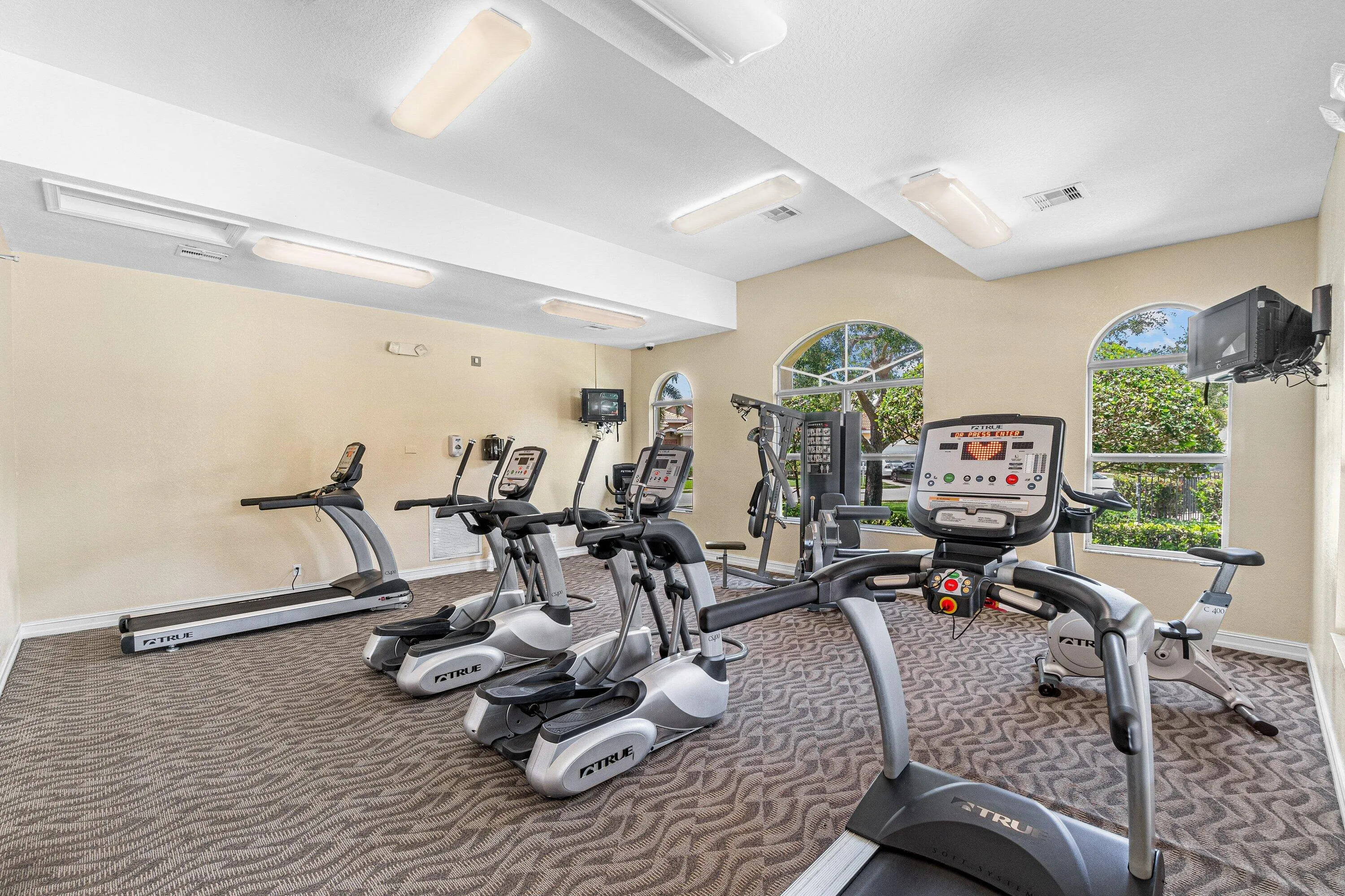 Fitness center with and multiple treadmills and equipment and weights