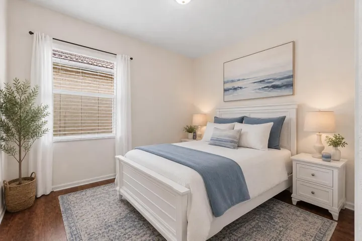 Room featuring luxury vinyl flooring, a single window with blinds, white baseboards, and neutral wall tones