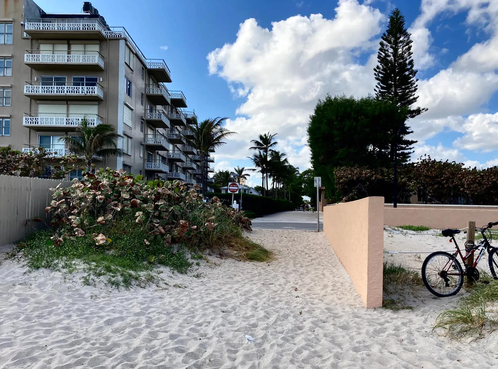 Beachfront building with multiple balconies and exterior walkways