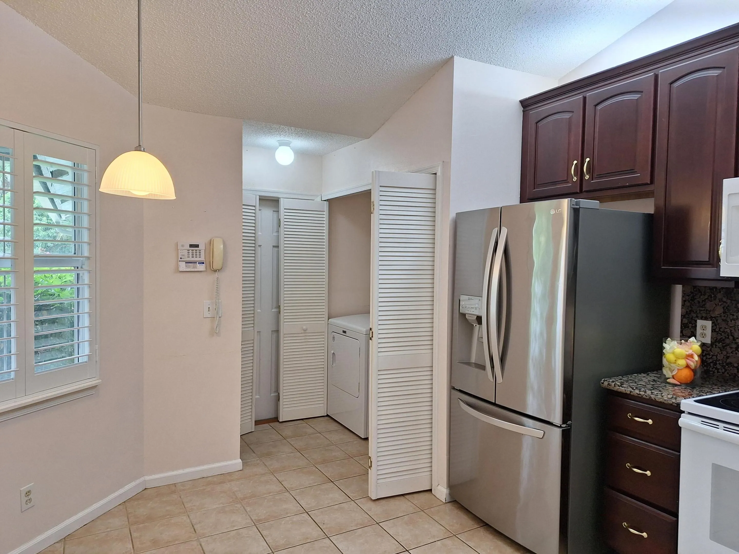Eat-in kitchen with laundry closet and garage access