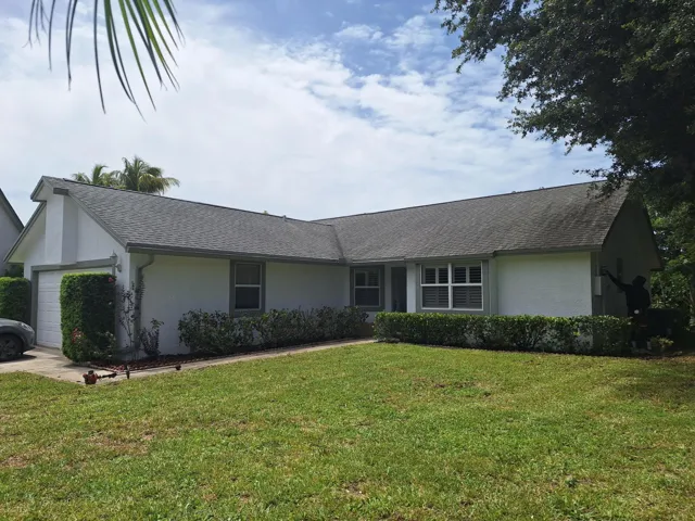 Front of house--repainted in 2025. White with medium green trim.