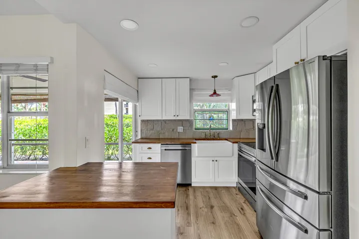 Kitchen is less than 2 years old -Butcher block island & countertops, wood cabinets.