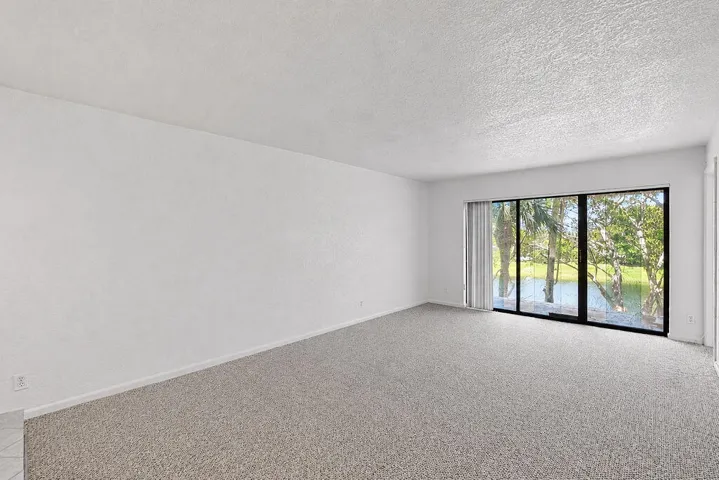 Living area & balcony with lake view