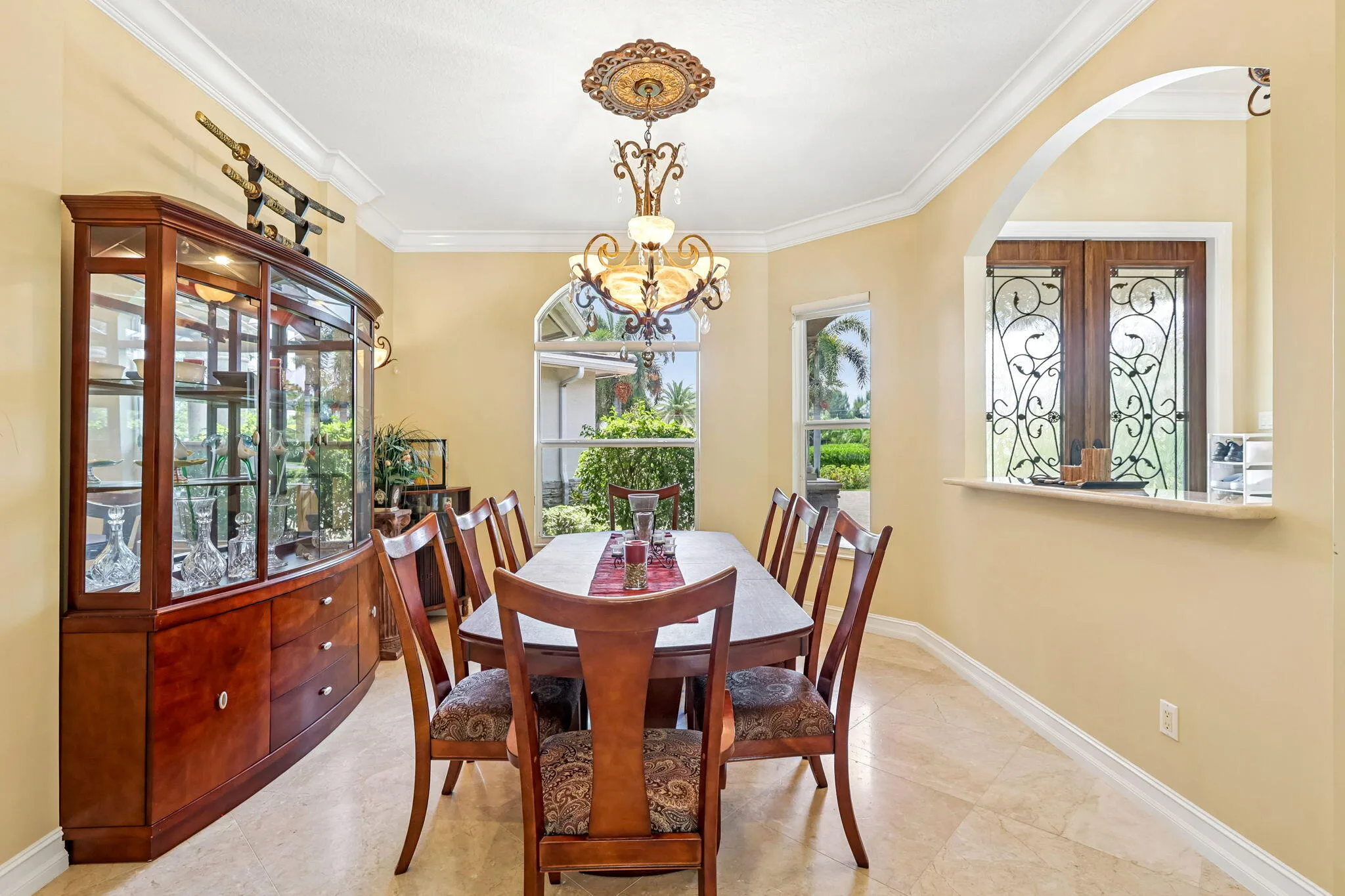 Formal dining area featuring neutral wall tones and tile flooring