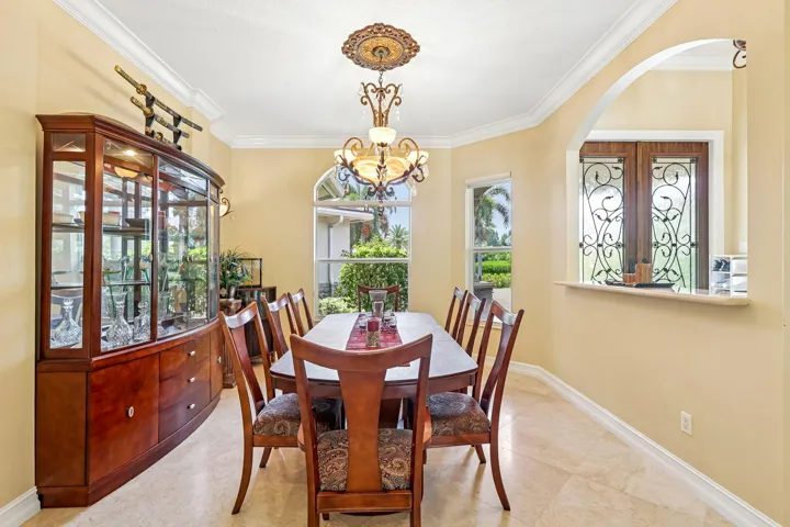 Formal dining area featuring neutral wall tones and tile flooring