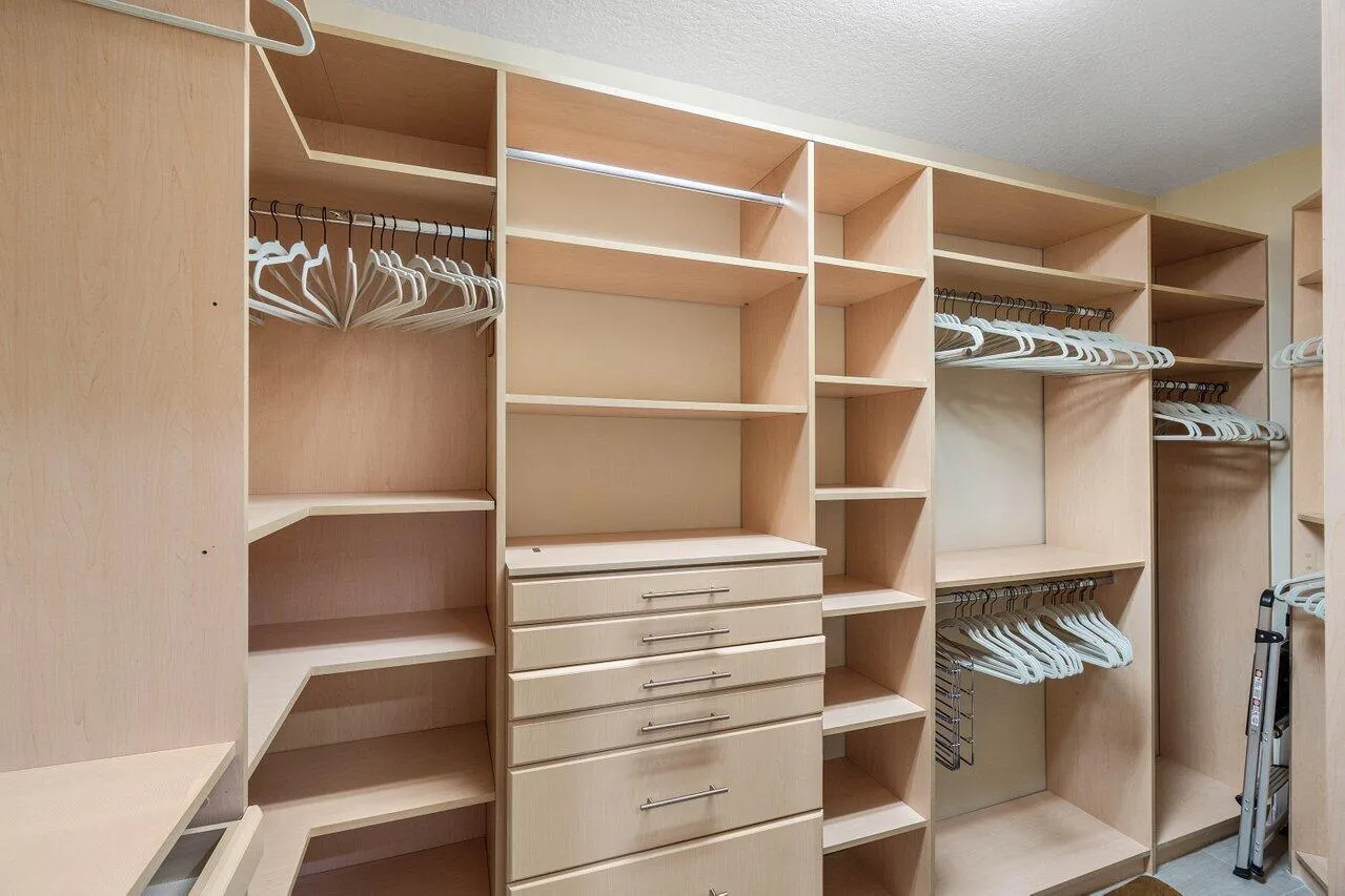 TWO WALK IN CUSTOM CLOSETS
