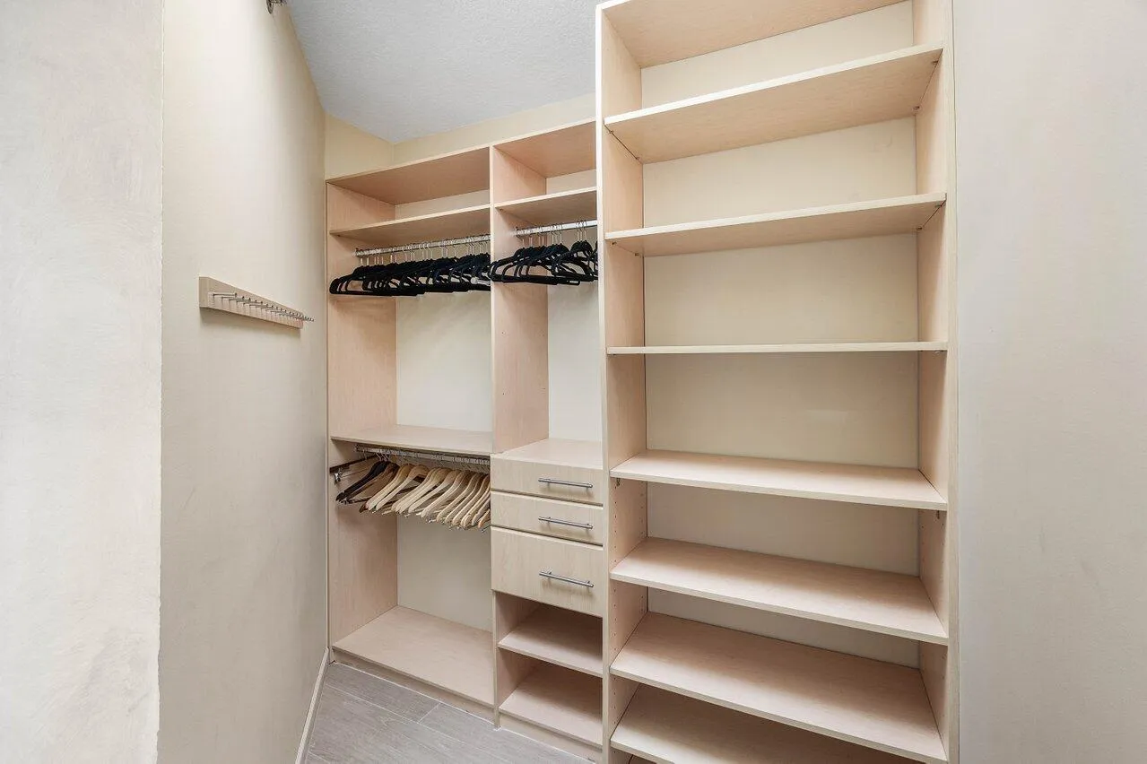 TWO WALK IN CUSTOM CLOSETS