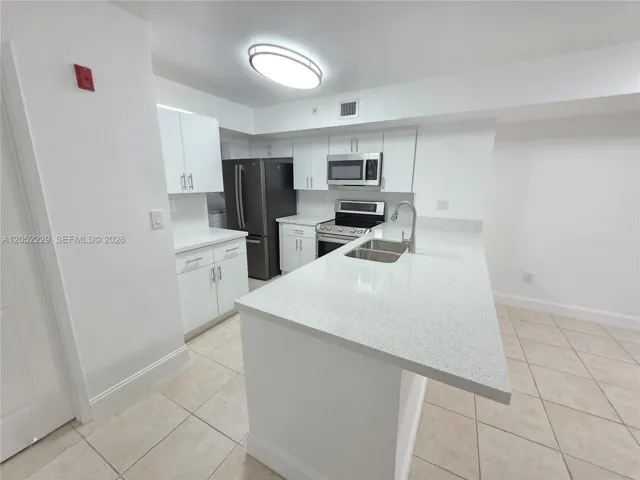 NEW QUARTZ COUNTERTOPS AND CABINETS