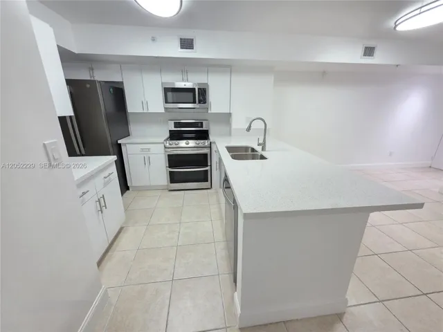 NEW QUARTZ COUNTERTOPS AND CABINETS