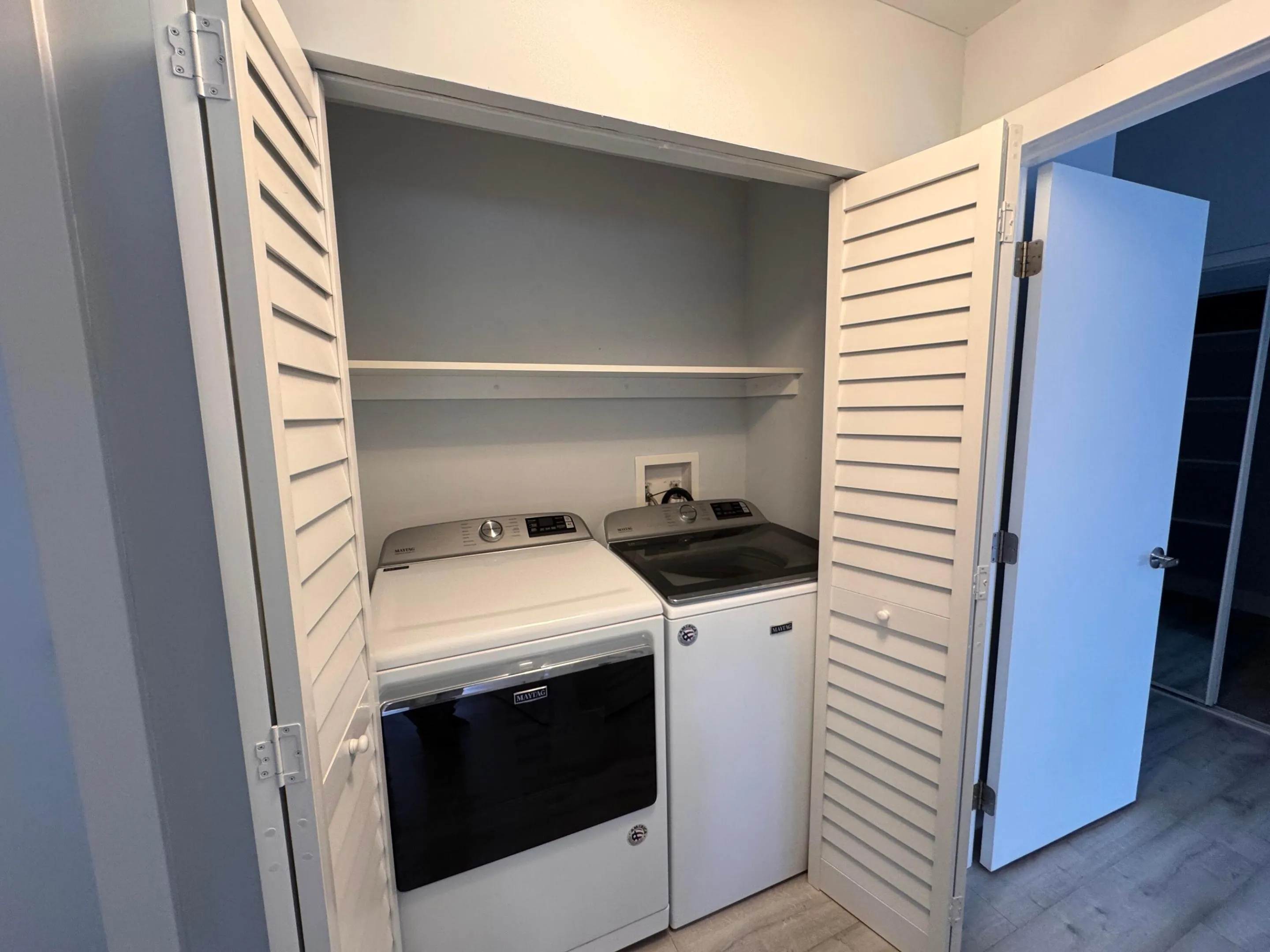 WAHER AND DRYER MYTAC ON HALLWAY CLOSET