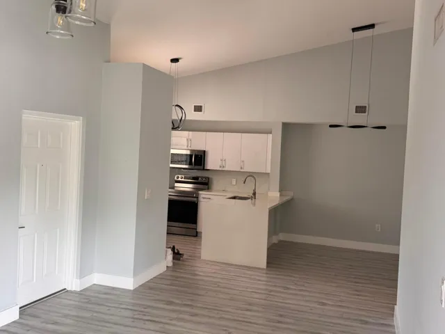 ENTRANCE TO LIVING AREA AND KITCHEN