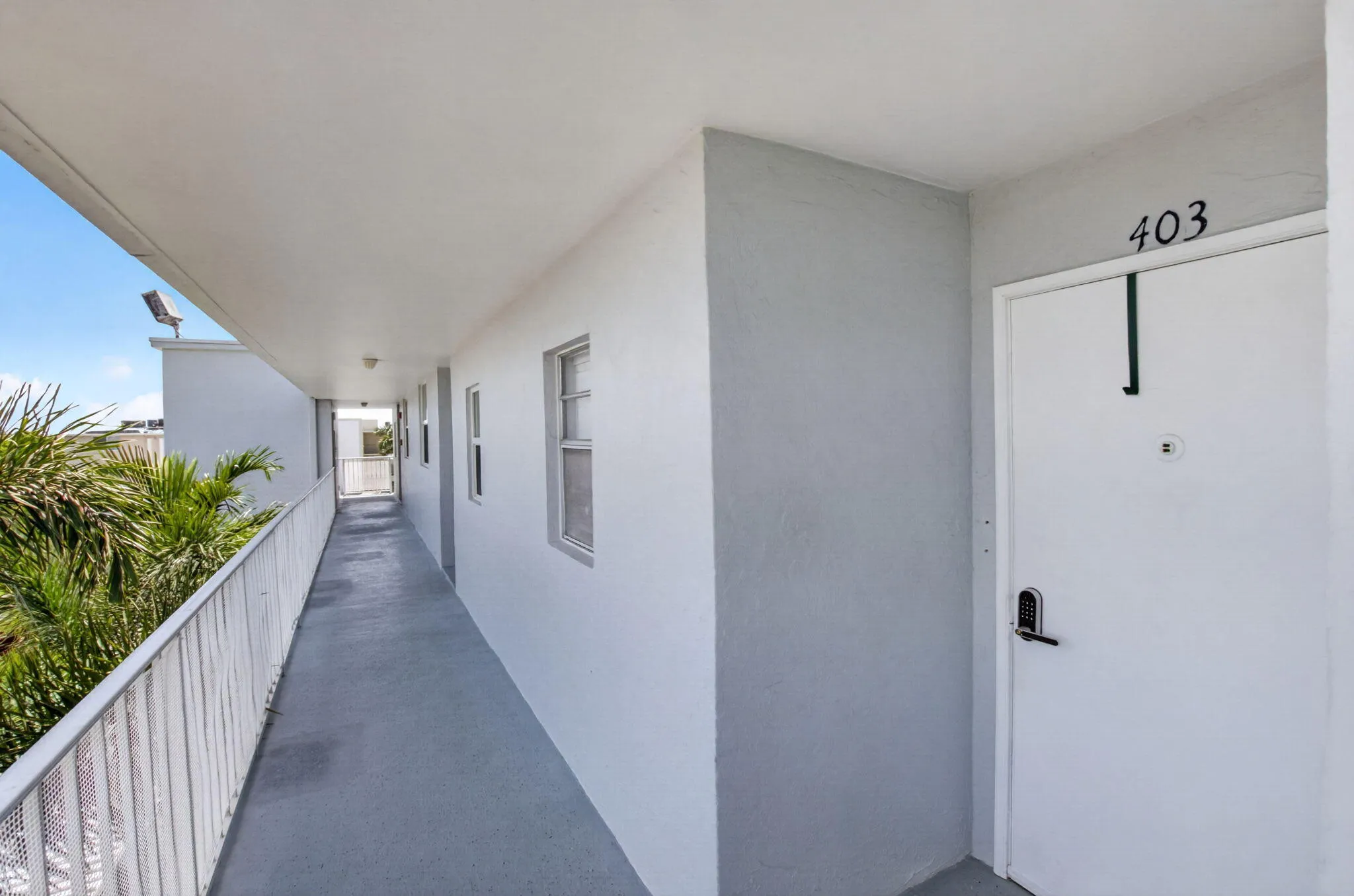 Entry door with digital lock and overhead unit number