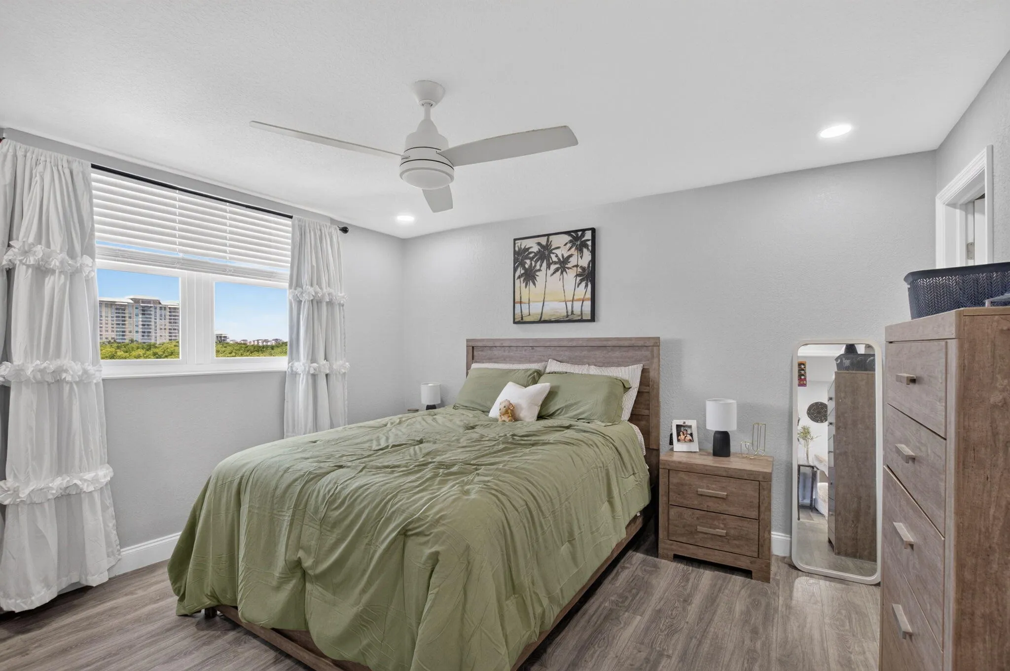 Bedroom featuring Vinyl wood-finish flooring, recessed lighting, and a ceiling fan
